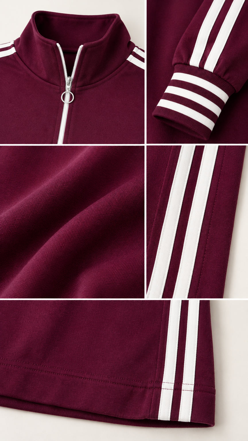 Close-up details of O-ring zipper collar, ribbed striped cuffs, and knit fabric
