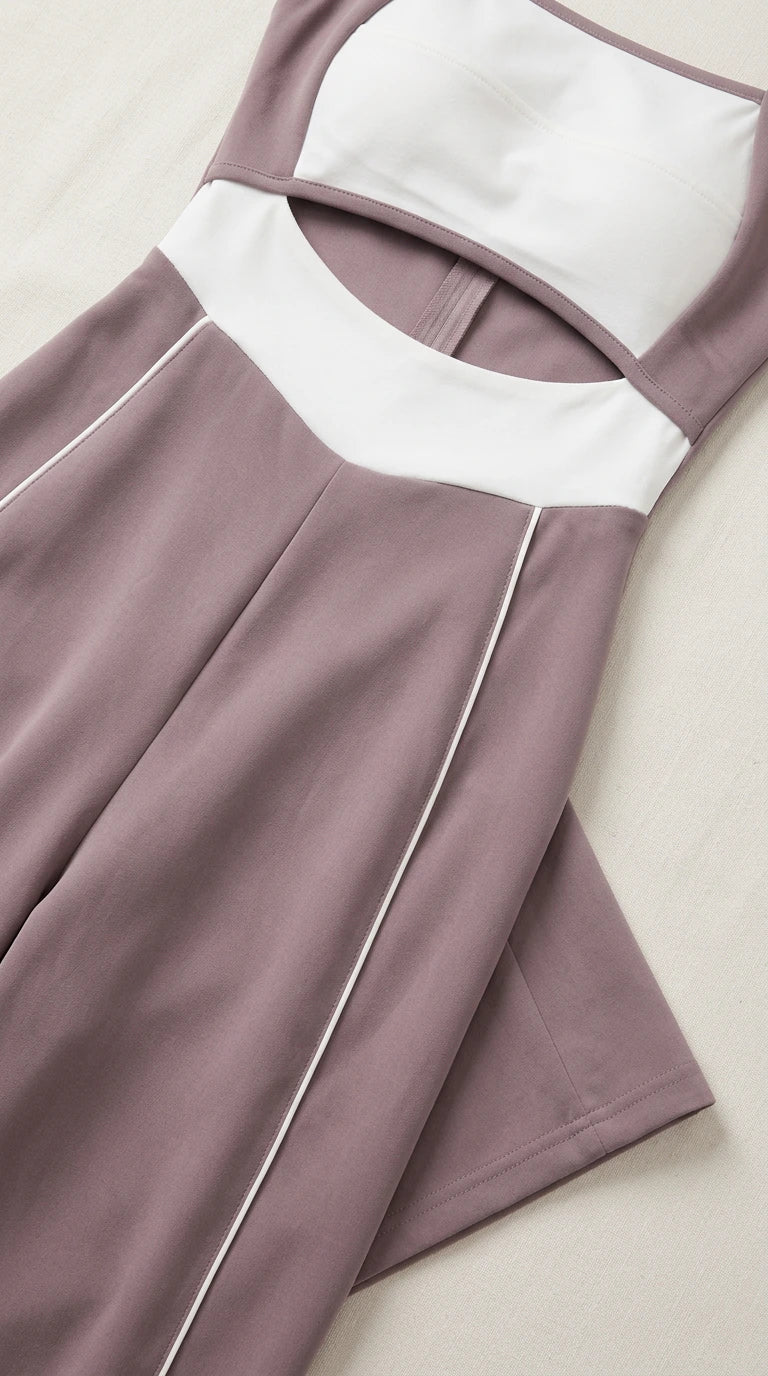 Close-up detail of cutout waist, contrast white panels, and side piping