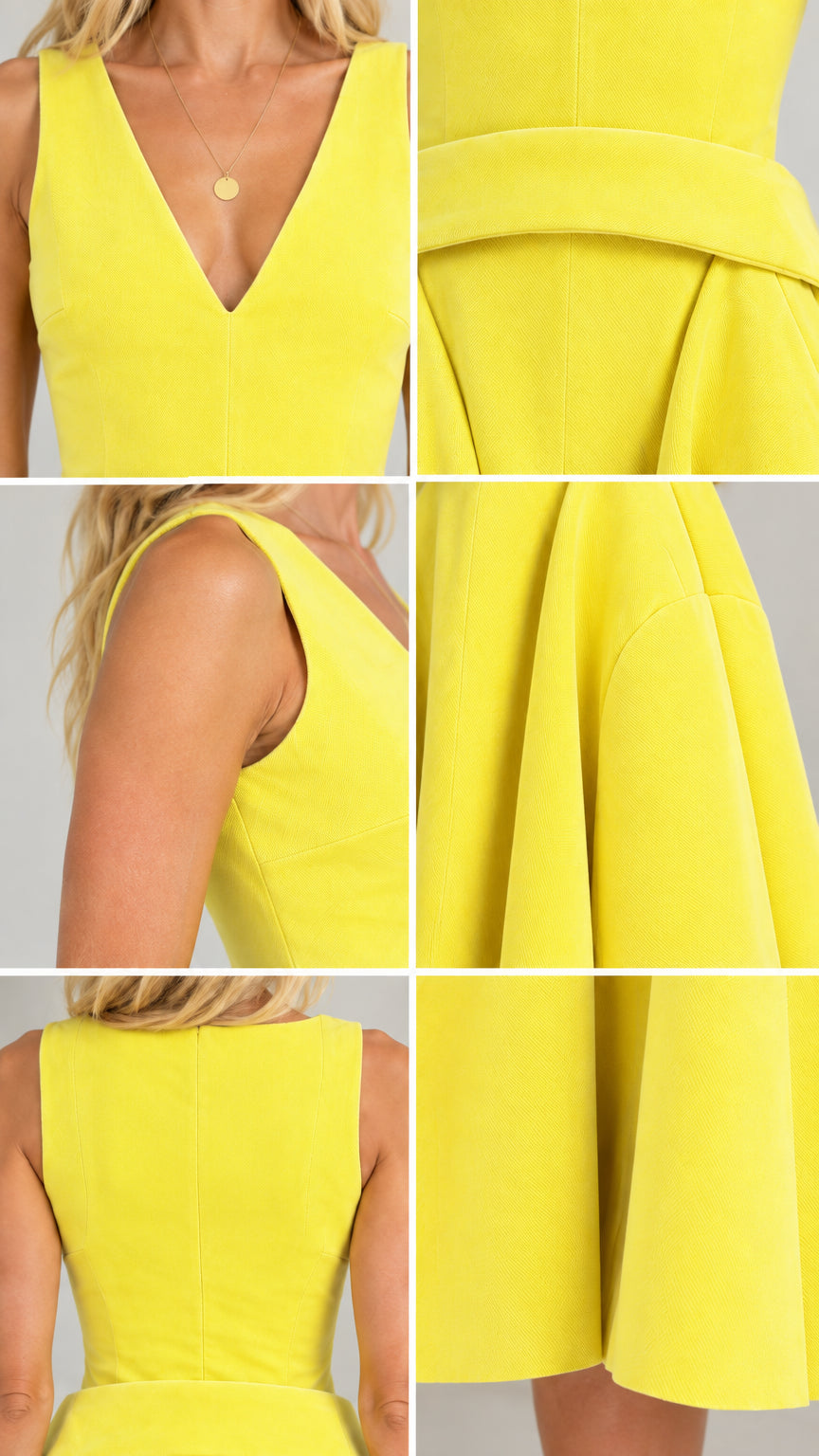 Close-up details of yellow midi dress neckline, waist band, and hem pleats