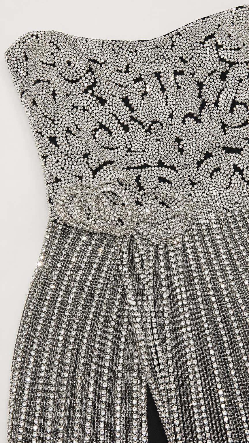 Close-up detail of the intricate bodice beadwork and rhinestone patterns