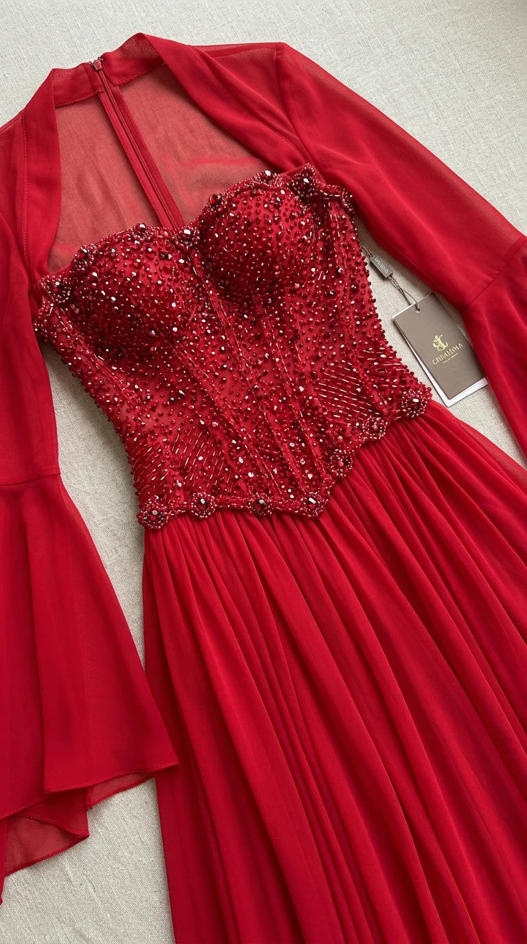 Close up of red beaded corset bodice and sheer neckline detail