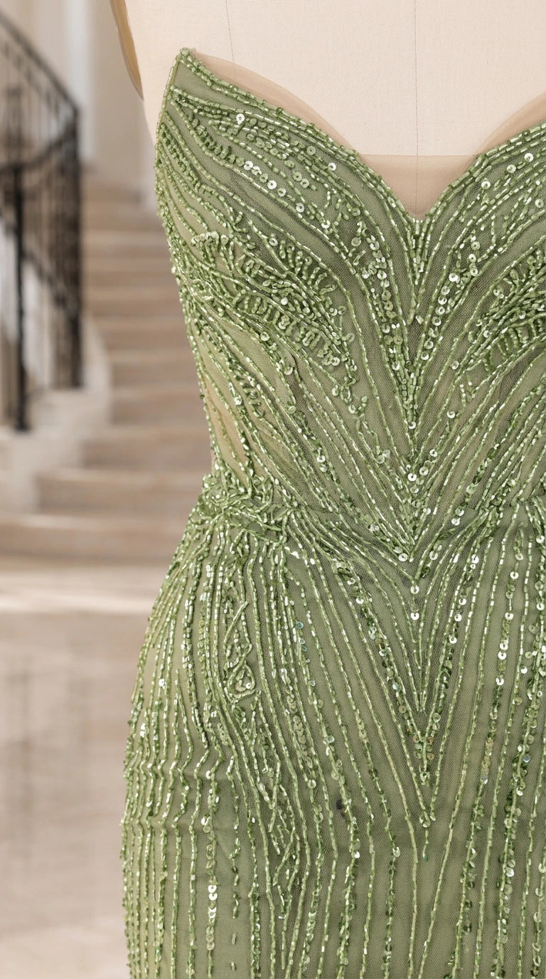 Close-up detail of sweetheart neckline and sequin pattern on sage green evening gown