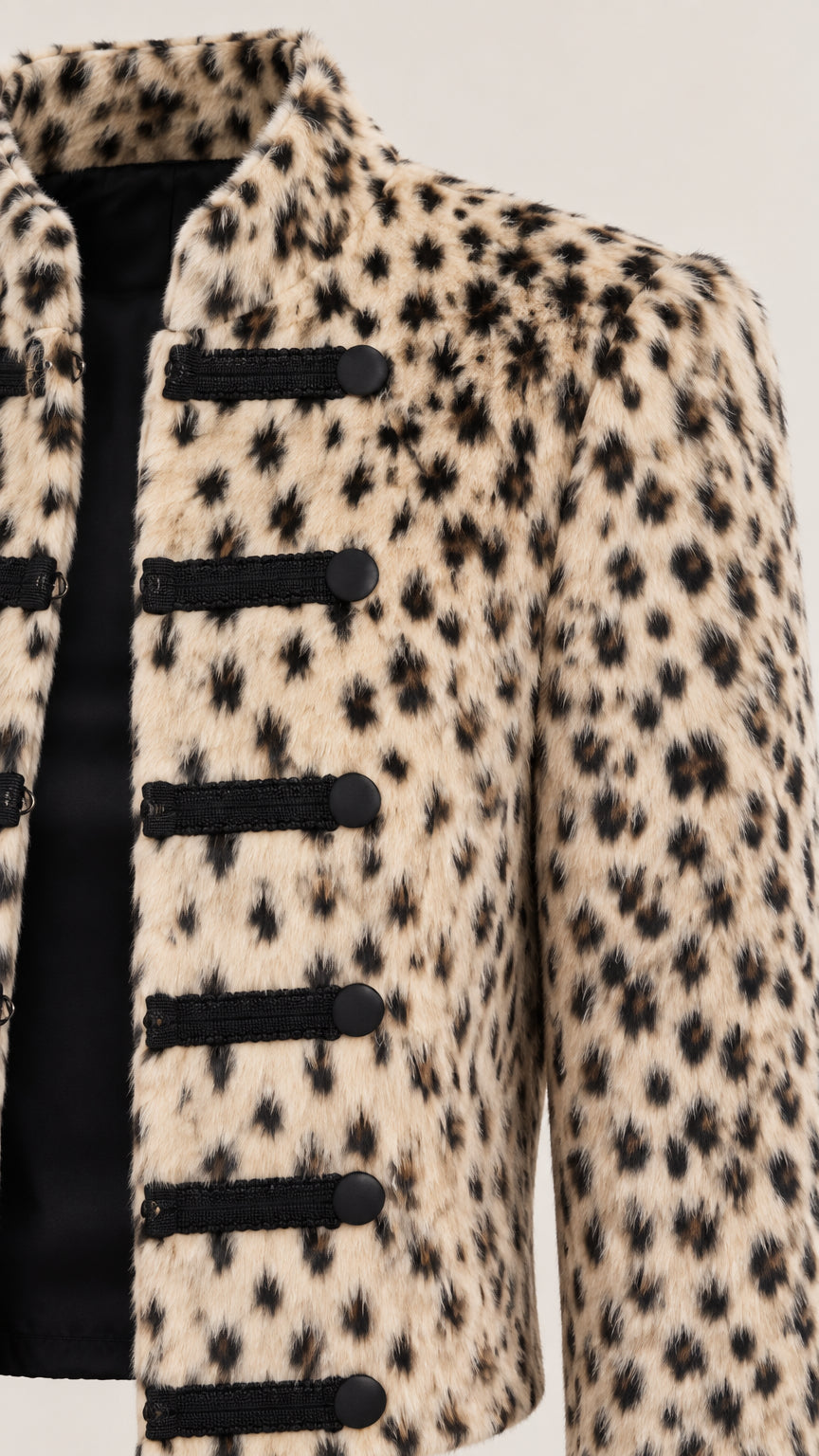 Close-up detail of textured fabric and black military frog fastenings on Beige Leopard jacket