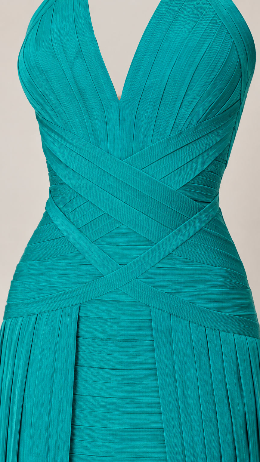 Close-up detail of teal crisscross bandage bodice and textured pleating