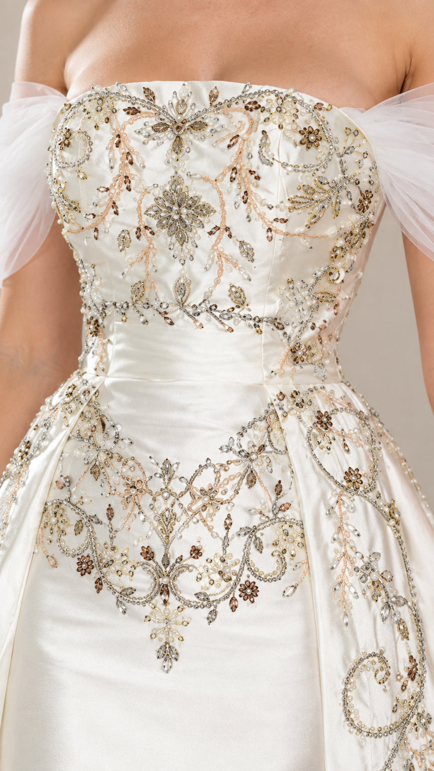 Close-up of intricate metallic floral embroidery on ivory satin bodice and waistline