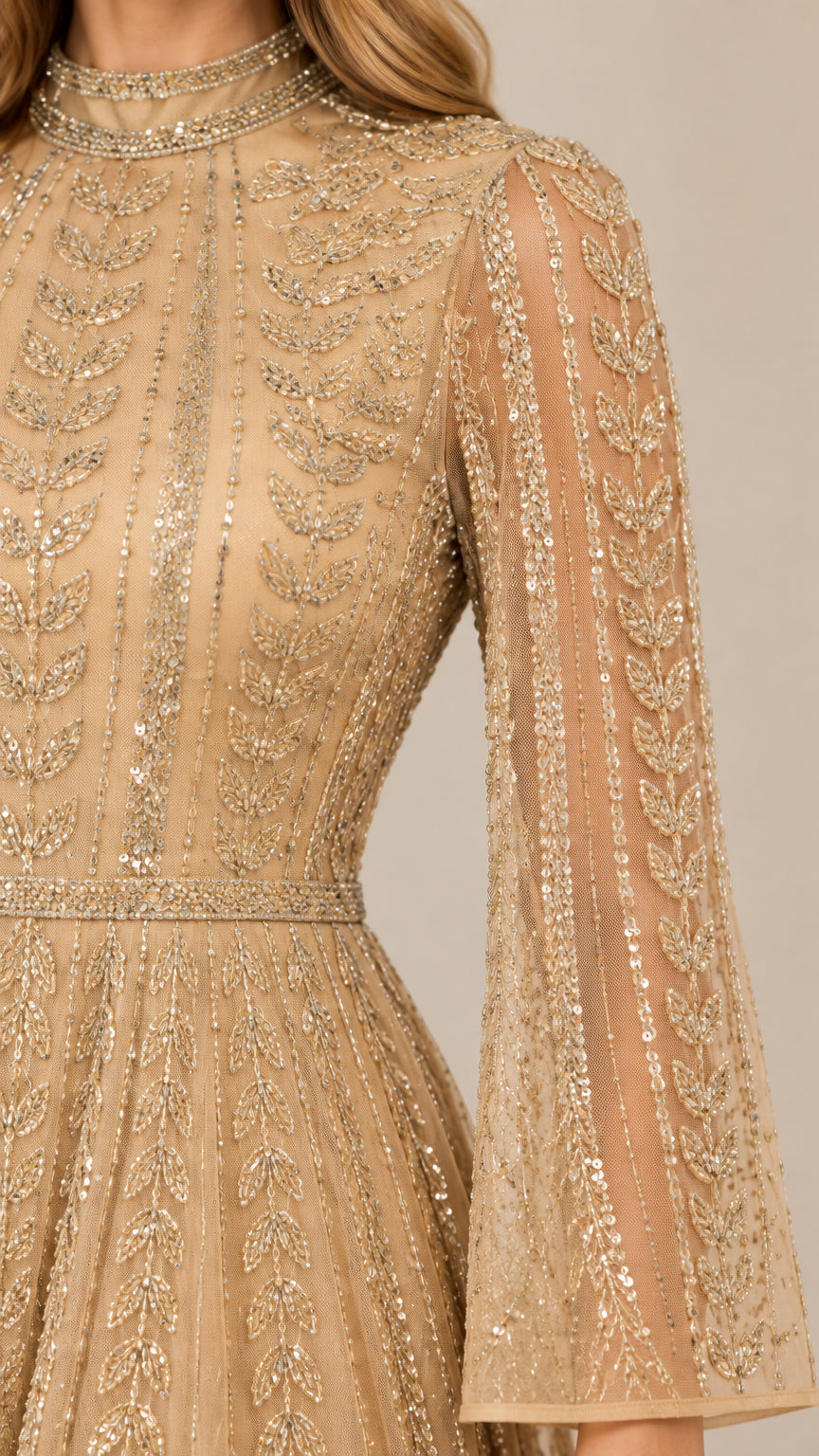 Close-up detail of botanical sequin embroidery and high collar on champagne gown