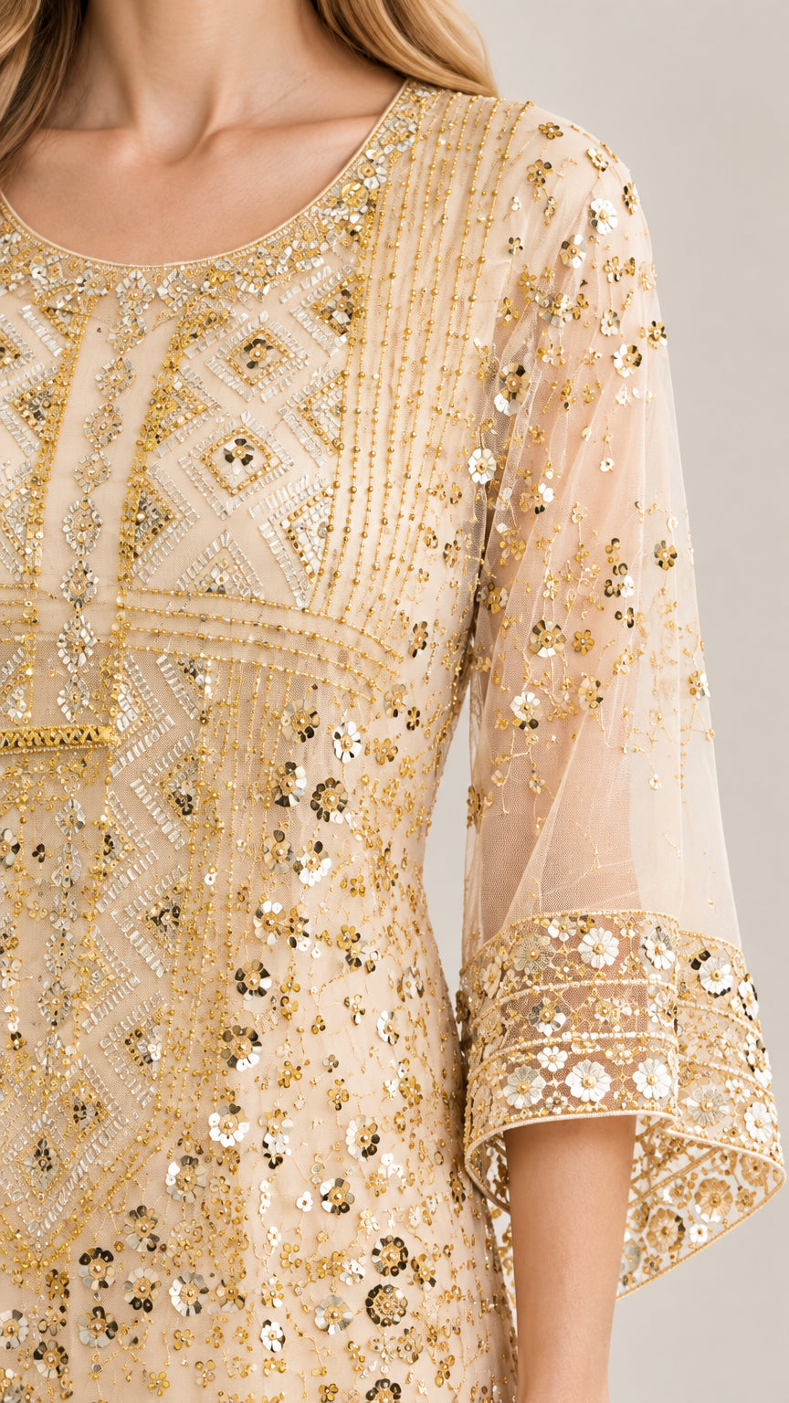 Close-up detail of bodice and flared sleeve showing intricate sequin embroidery and beadwork