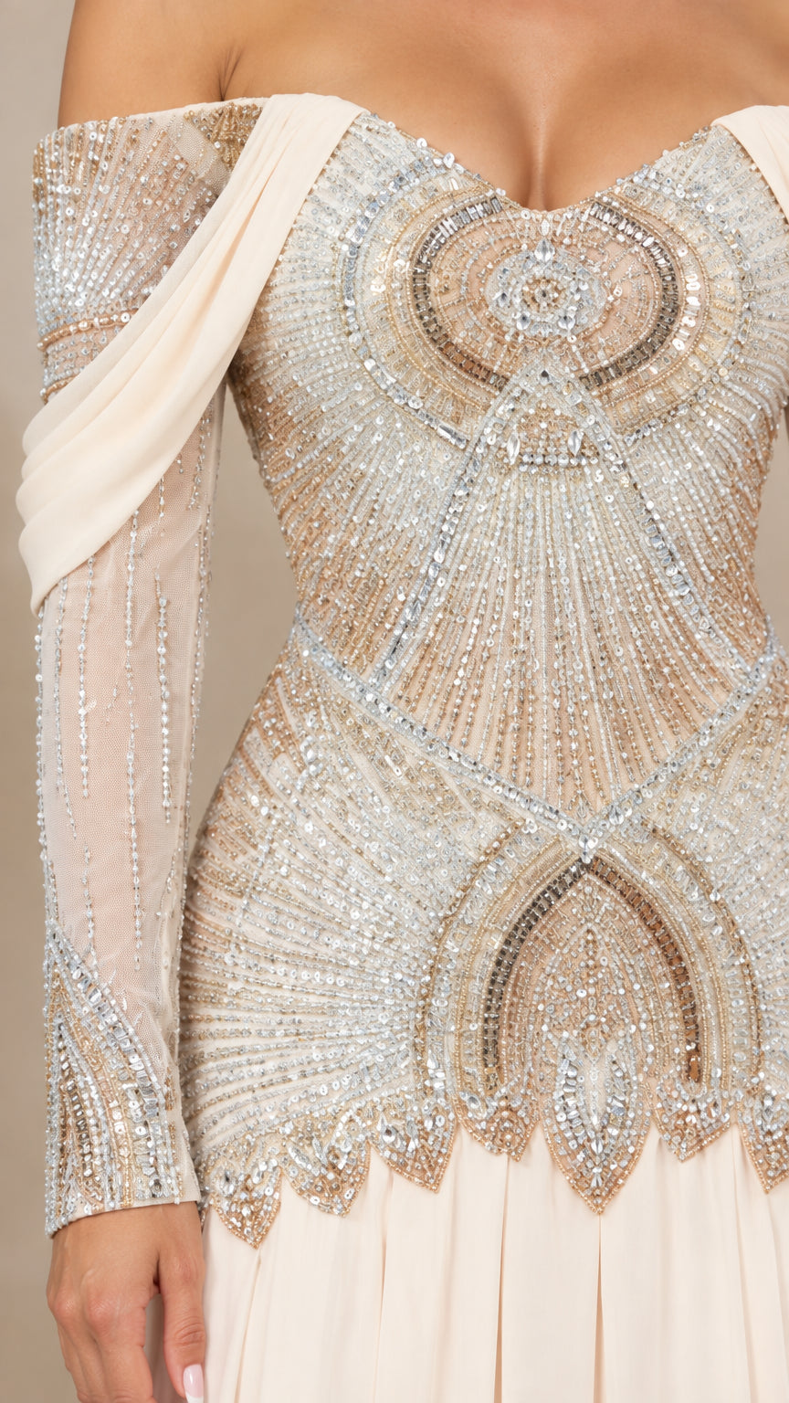 Close-up of intricate beaded and sequin embellishments on champagne gown bodice