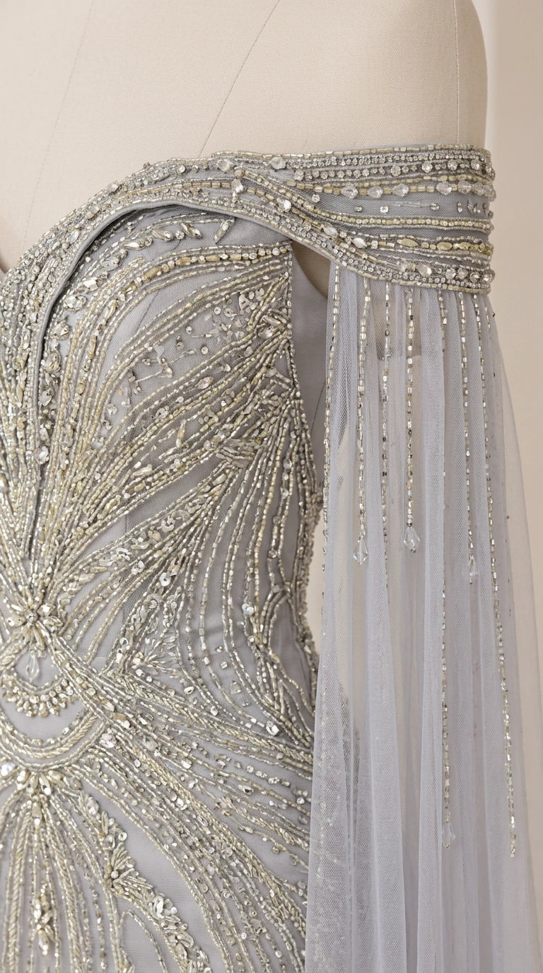 Close-up detail of shoulder beading, crystals, and delicate draped fringe