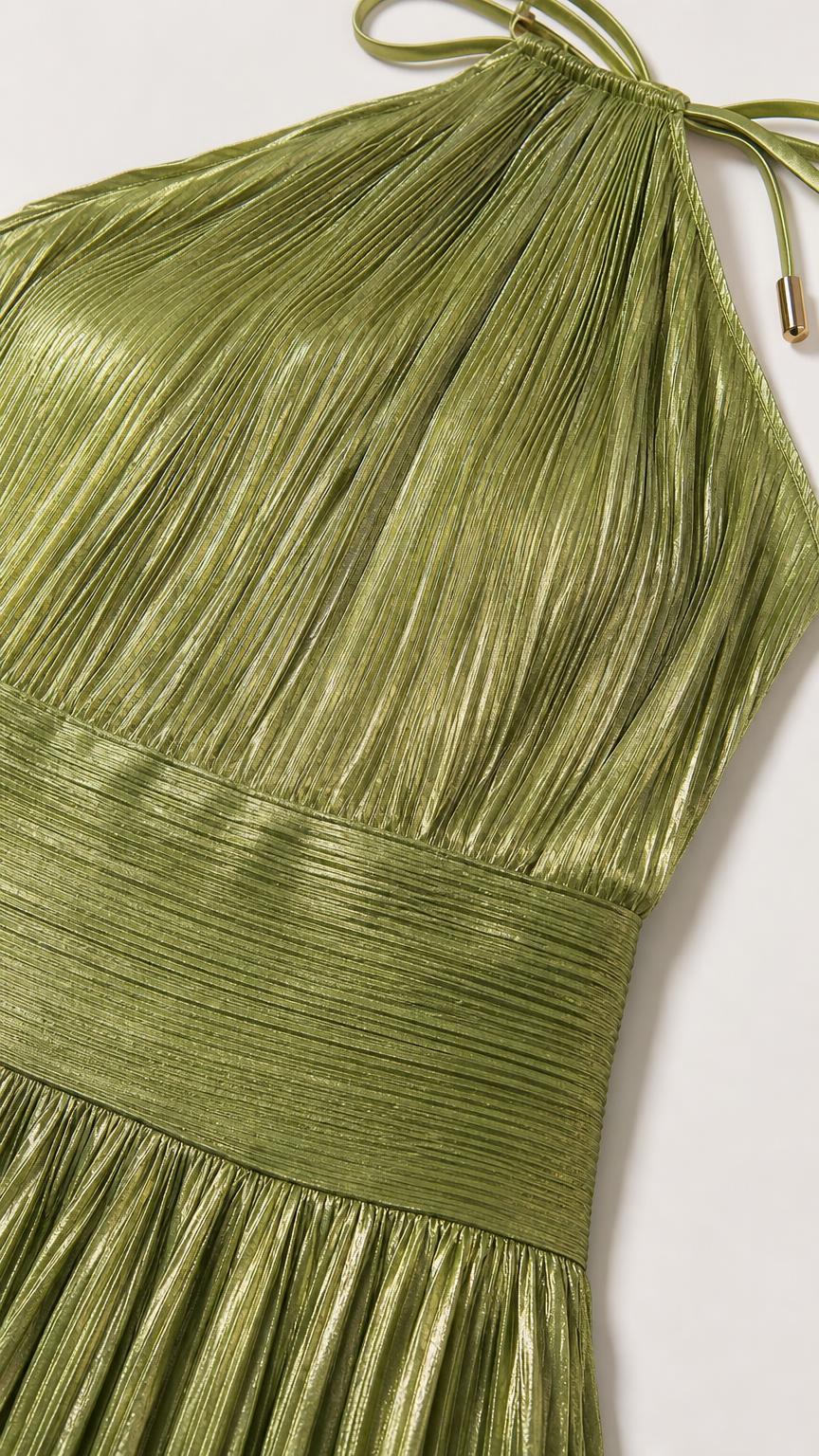 Close-up of green metallic pleated fabric and halter neck tie