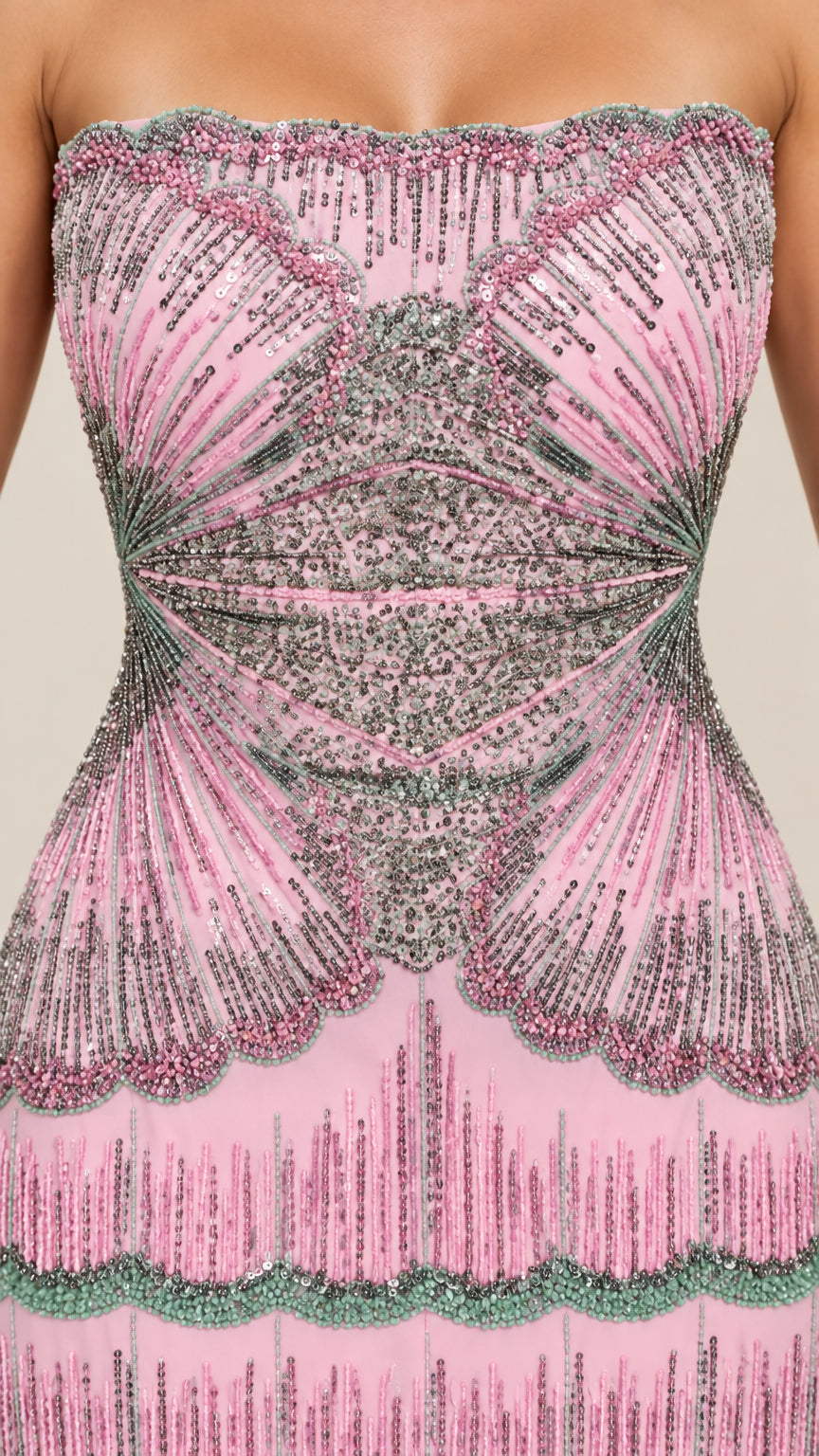 Close-up detail of intricate beadwork and sequins on pink strapless bodice