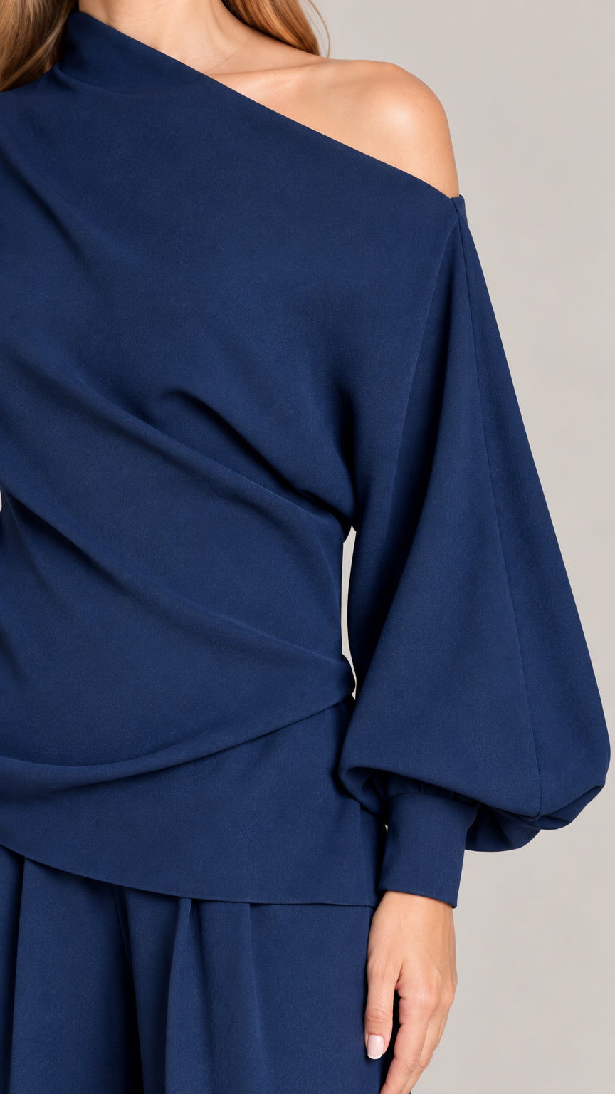 Close-up detail of Navy Blue draped neckline and lantern sleeve
