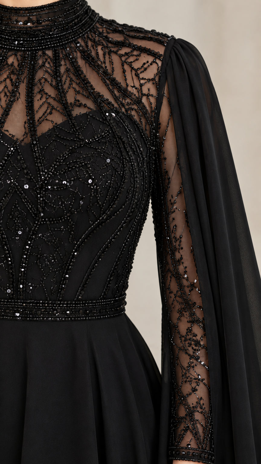 Close-up detail of high collar, intricate beading, sequins, and sleeve construction on black gown