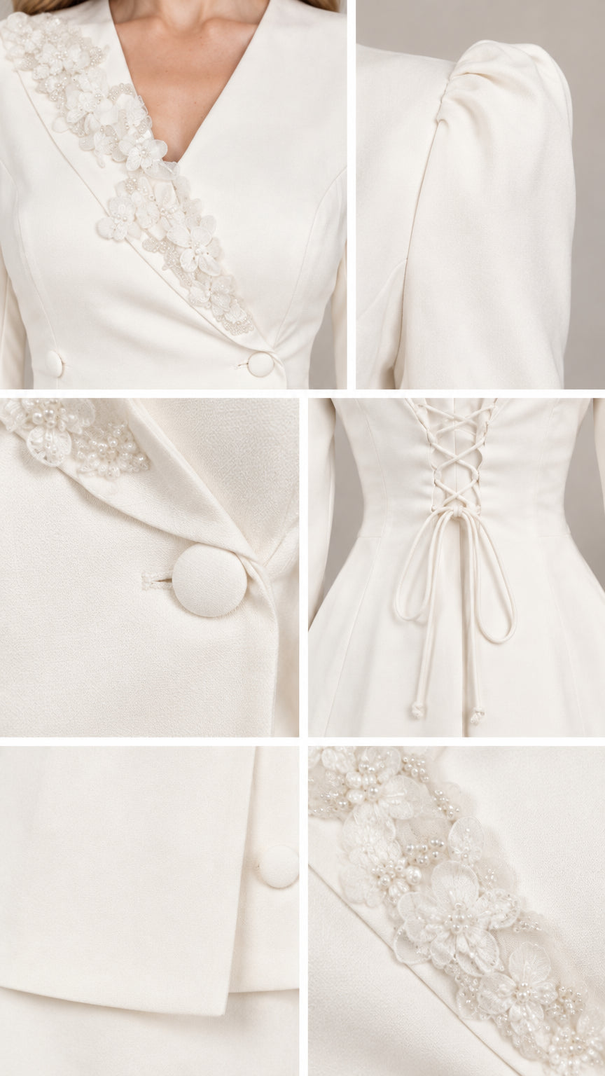 Close-up details of lace lapel beadwork, covered buttons, corset tie, and hem lace