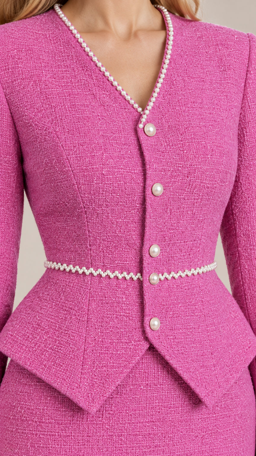 Close-up detail of Rose Pink tweed fabric, V-neckline with pearl trim, and pearl buttons