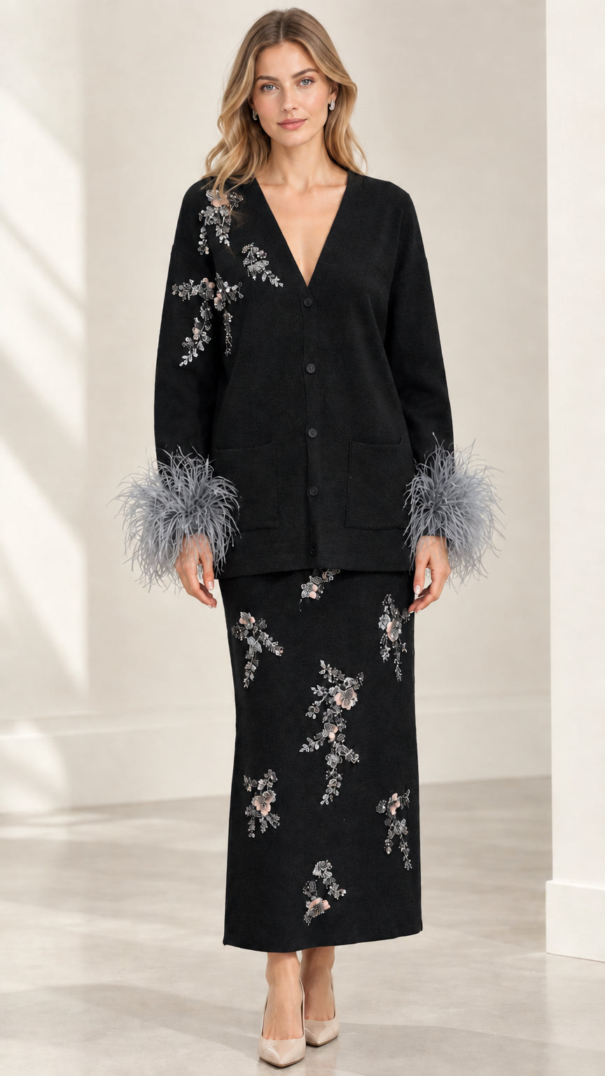 Model wearing Black floral beaded knit cardigan and maxi skirt set with feather cuffs
