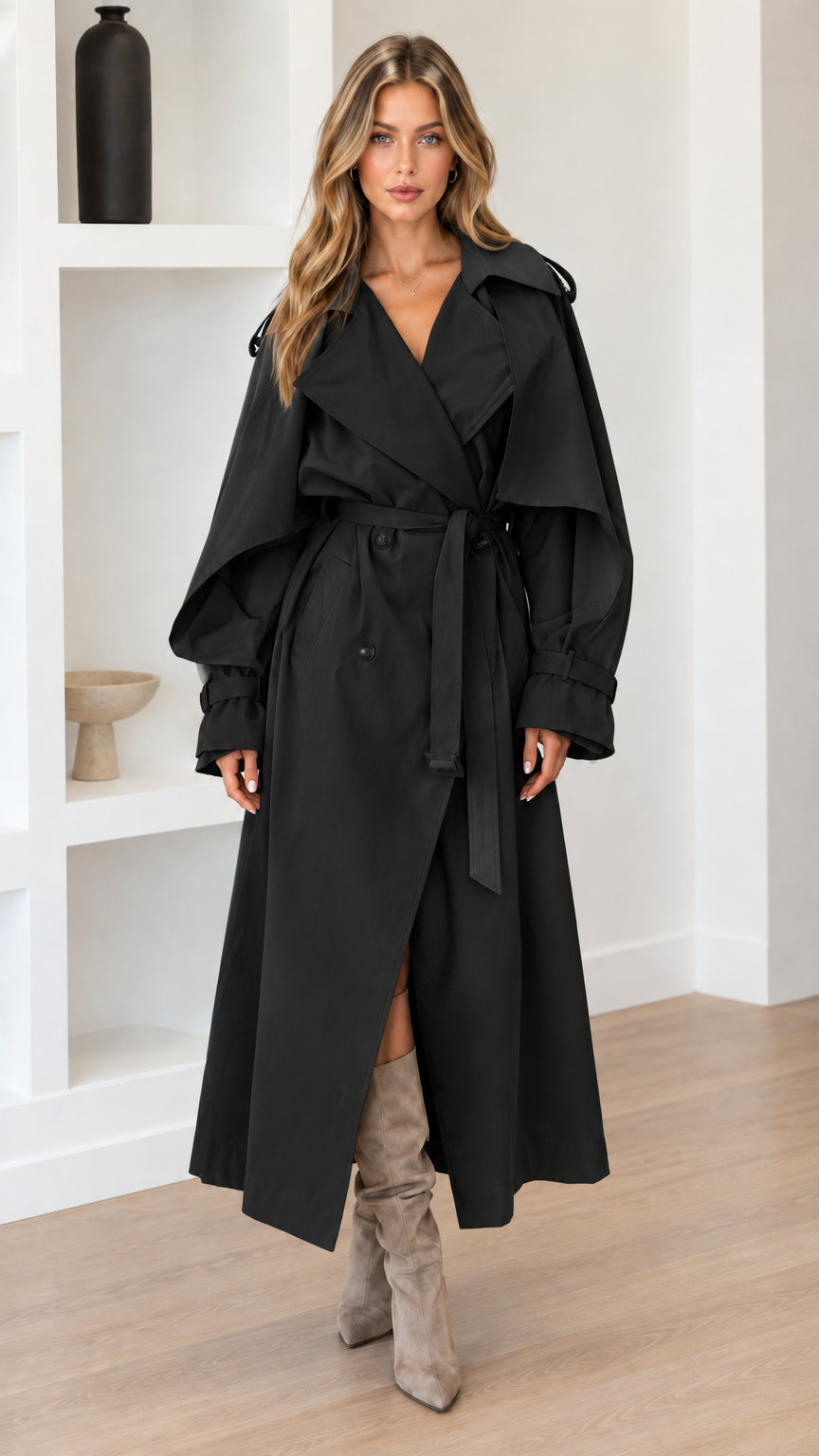 Full-length view of woman wearing Black maxi belted trench coat with boots