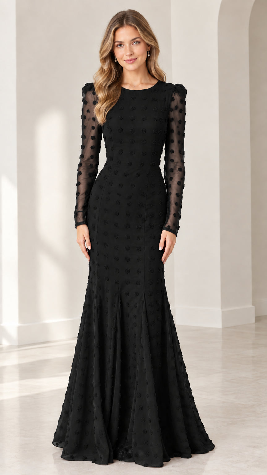 Full front view of model wearing black long sleeve swiss dot mermaid evening gown