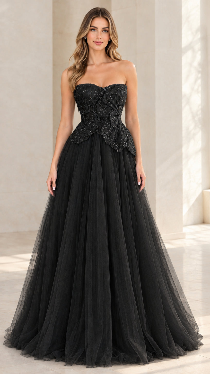 Model wearing black strapless beaded tulle evening gown