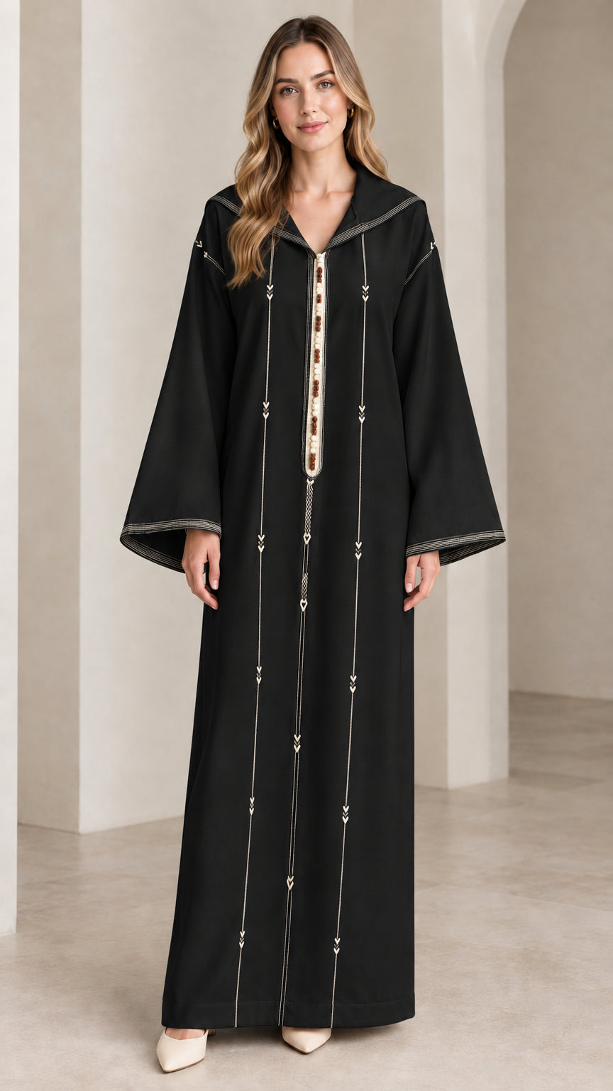 Front view of woman wearing black hooded djellaba kaftan maxi dress
