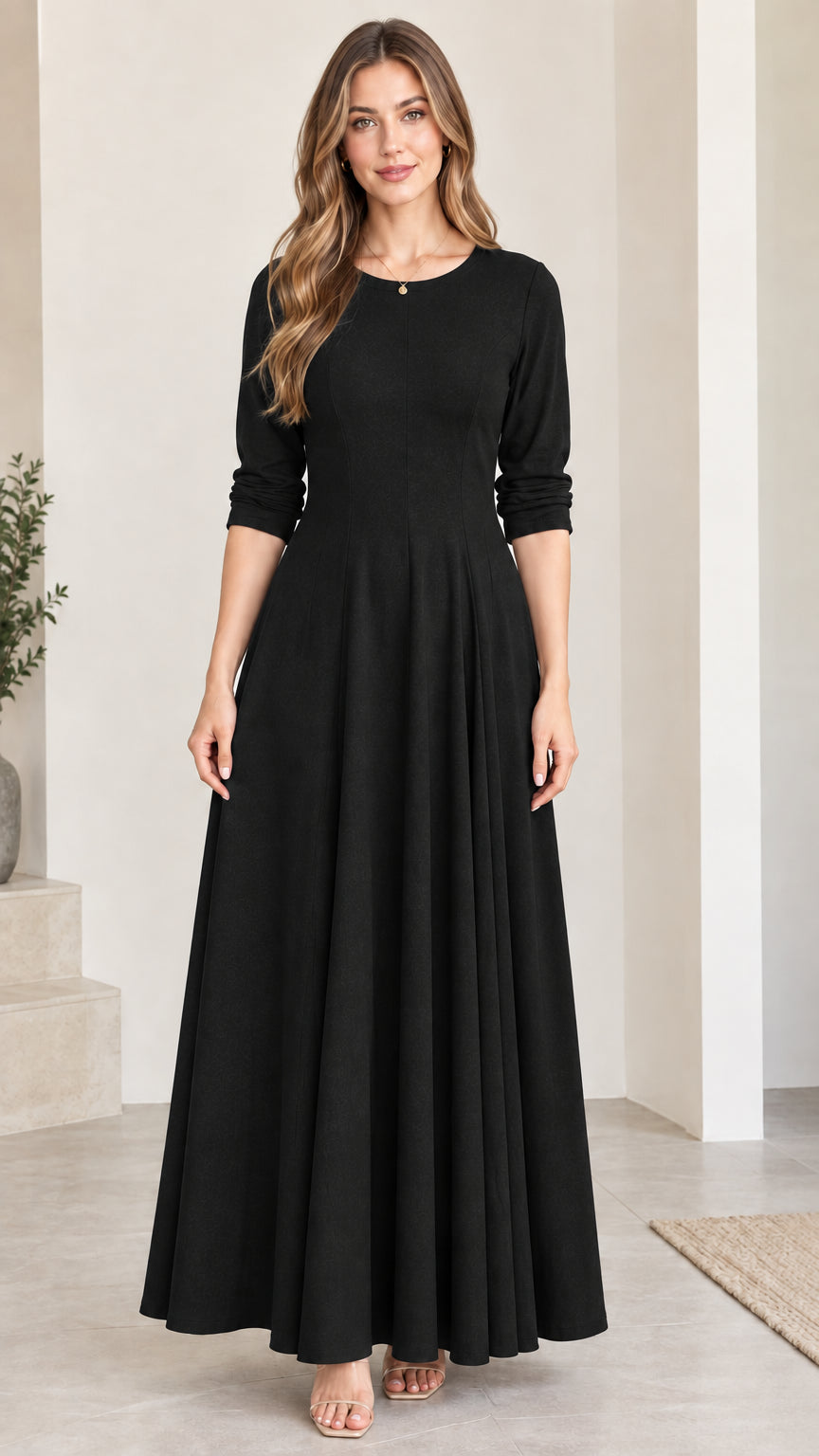 Front view of woman wearing classic black 3/4 sleeve flared maxi dress