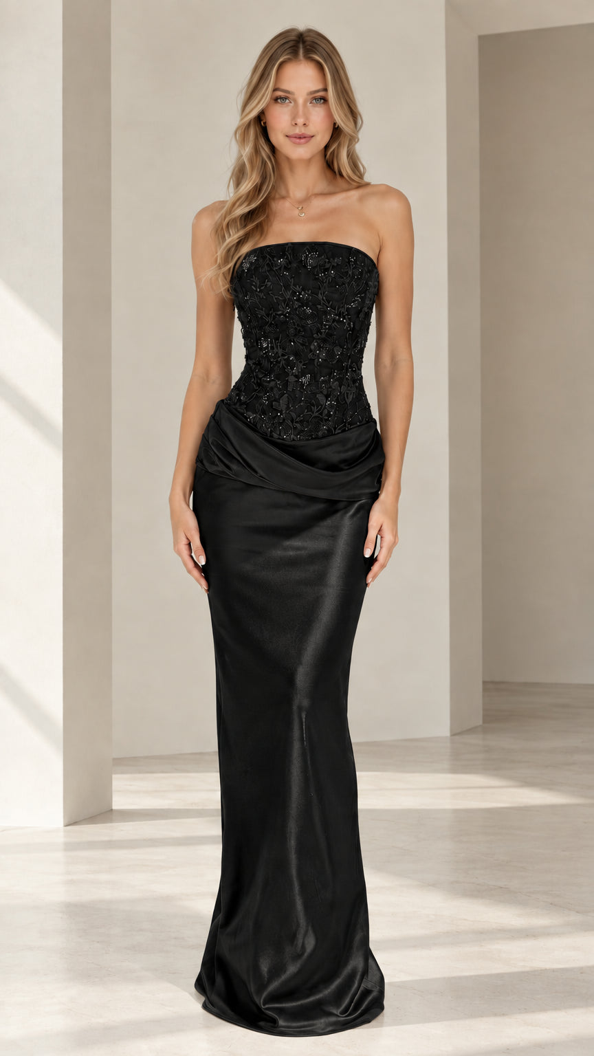 Model wearing black strapless beaded corset satin evening gown