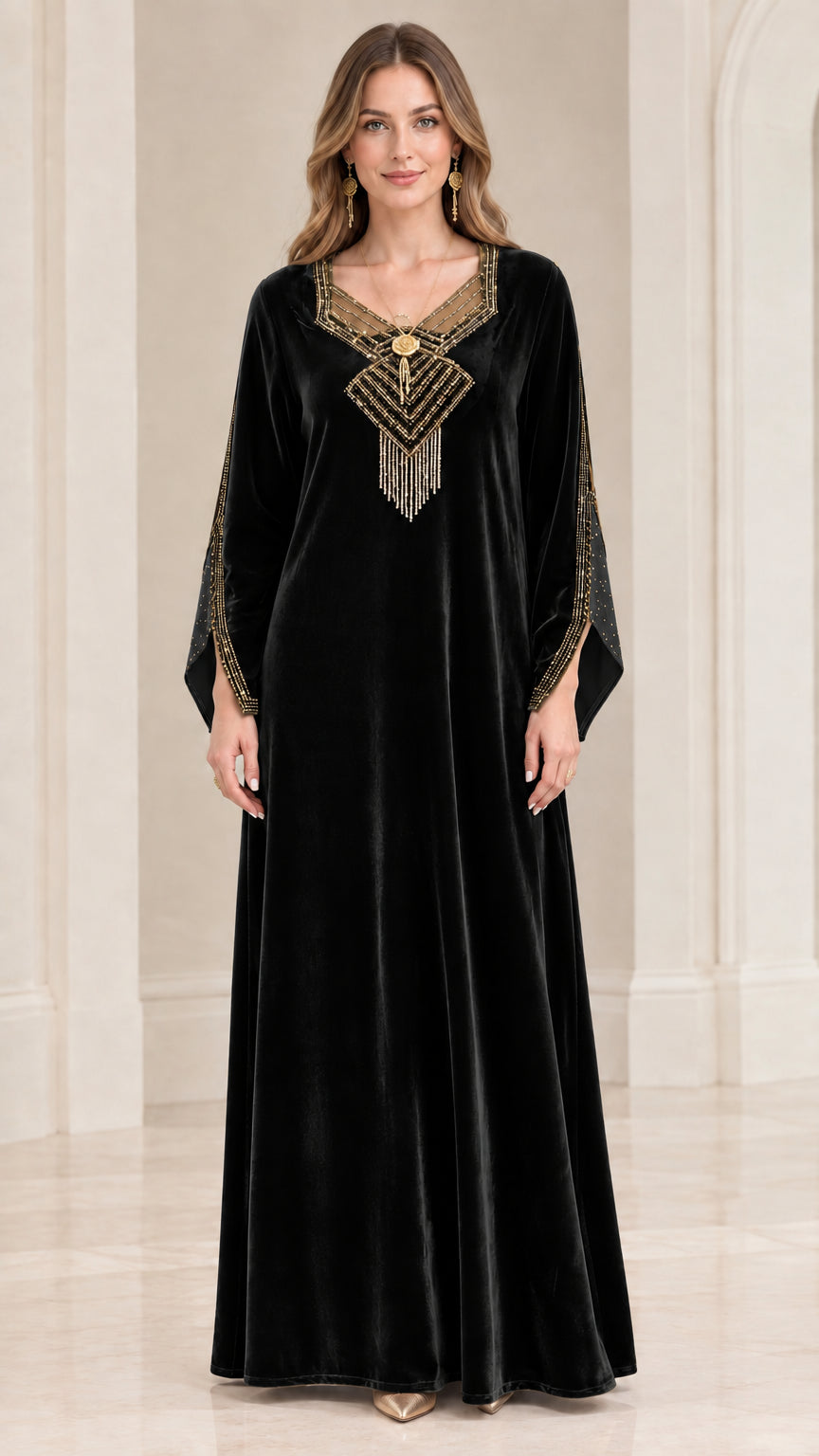 Front view of black velvet kaftan maxi dress with gold beaded embellishments
