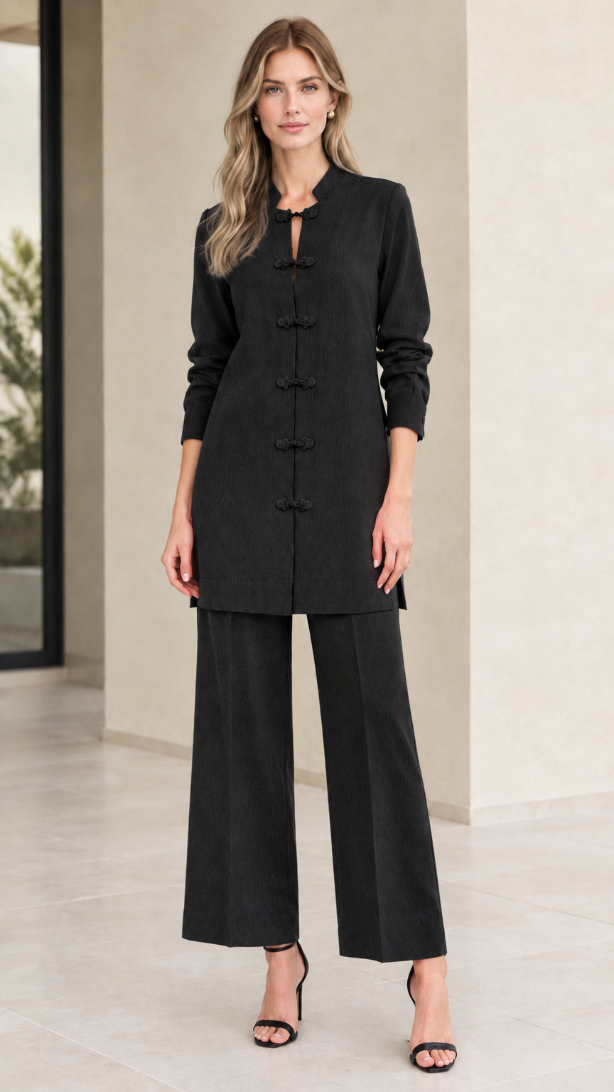 Front full-length view of woman wearing Black mandarin collar tunic and matching wide leg pants set