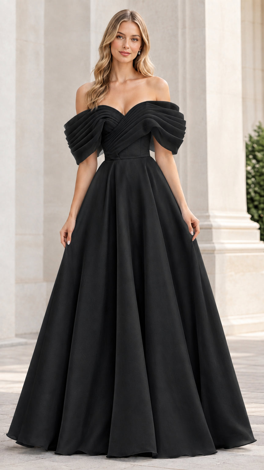 Model wearing a black off-the-shoulder pleated A-line evening dress