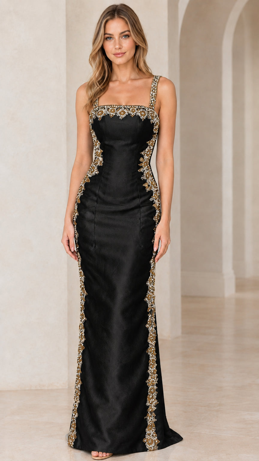 Front view of woman wearing Black satin column maxi dress with gold beaded embellishments