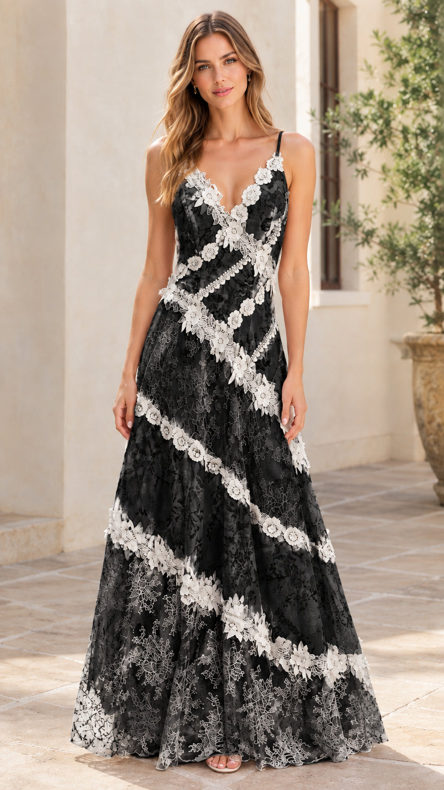 Woman wearing black floral lace V-neck maxi gown with contrast white trim