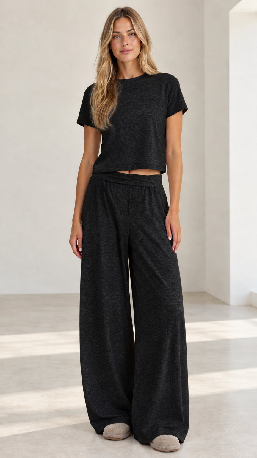 Model wearing heather black short sleeve crop top and wide leg lounge pants set