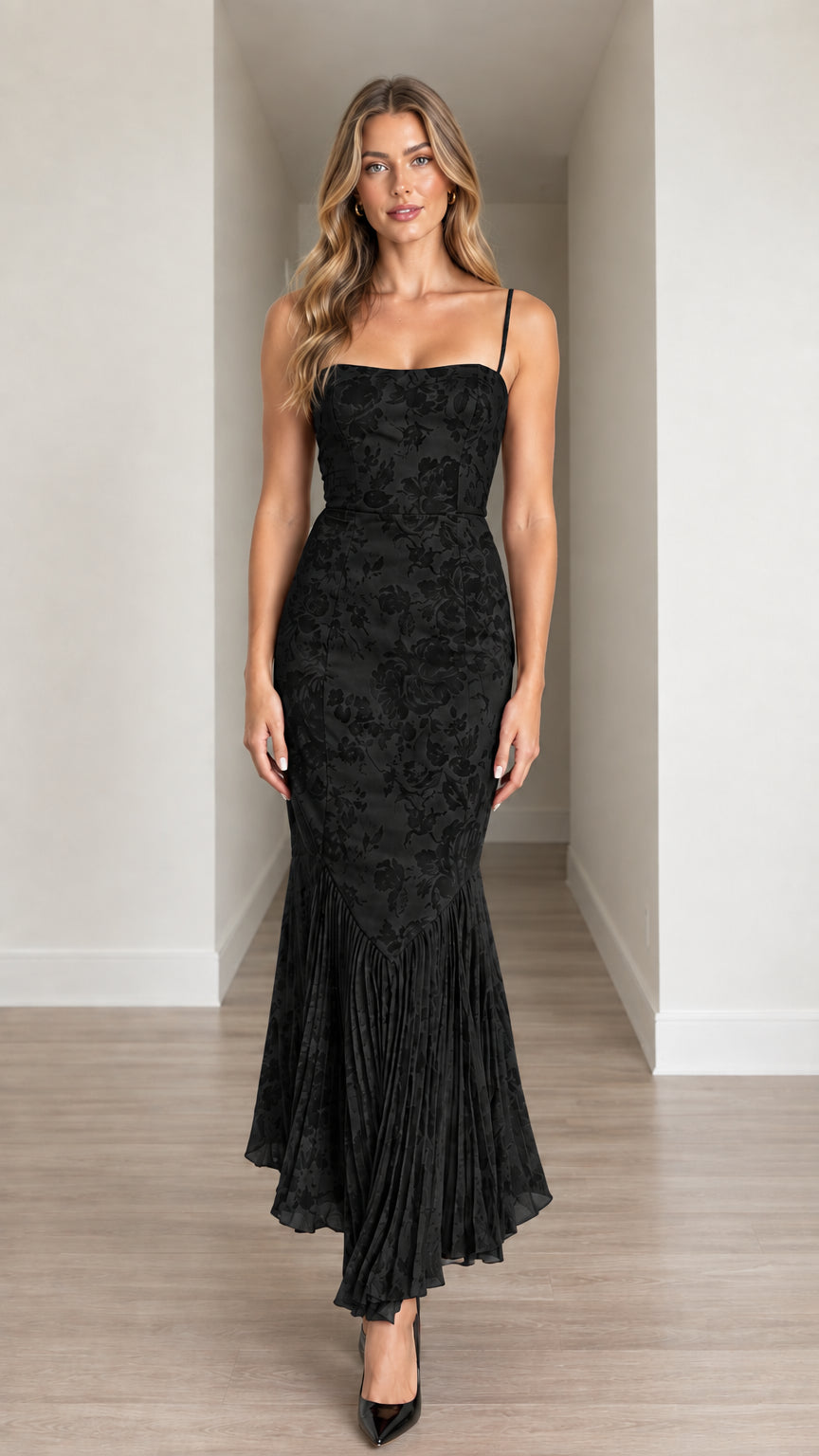 Front view of model wearing Black Floral Jacquard Pleated Mermaid Hem Midi Dress