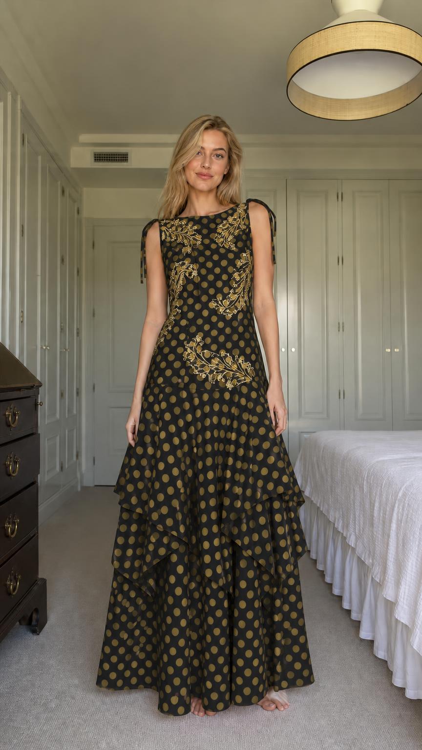 Model wearing black polka dot tiered maxi dress