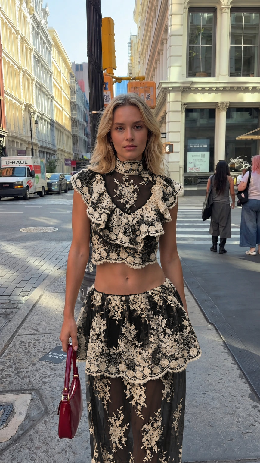 Model wearing black and cream floral lace crop top and tiered maxi skirt set