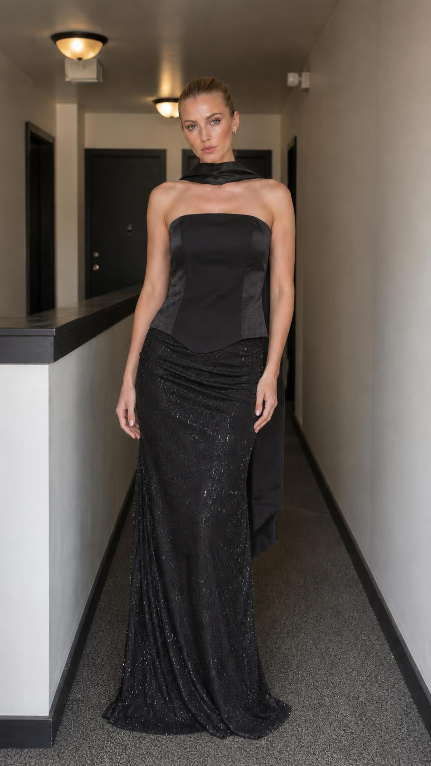 Model wearing black evening gown set with corset bodice