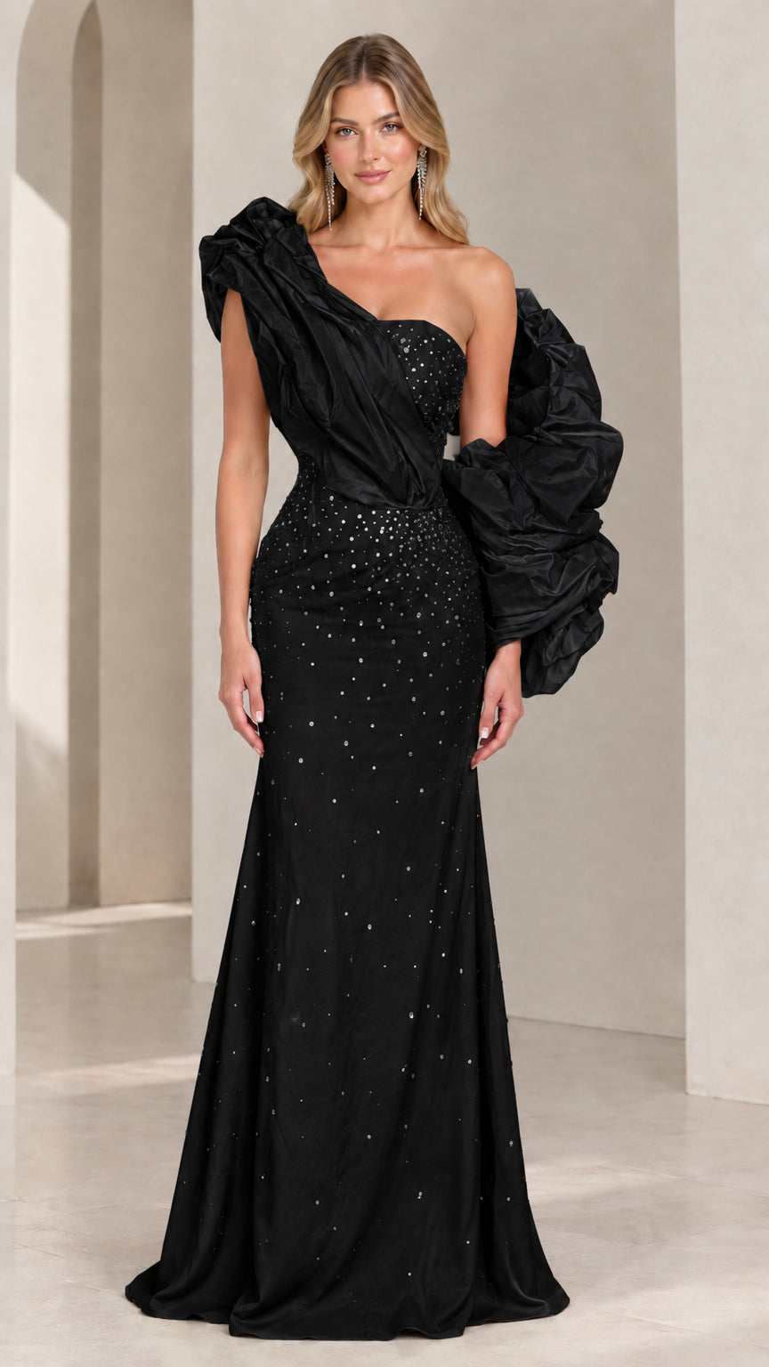 Classic black one-shoulder evening gown with voluminous sculptural sleeve