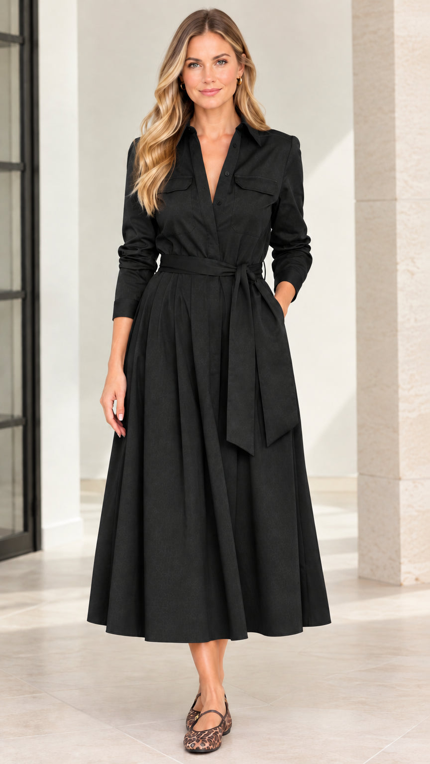 Model wearing classic black long sleeve belted A-line midi shirt dress