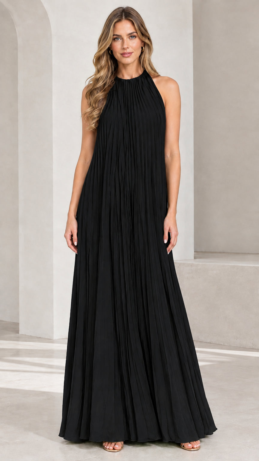 Front view of woman wearing Black pleated halter maxi dress