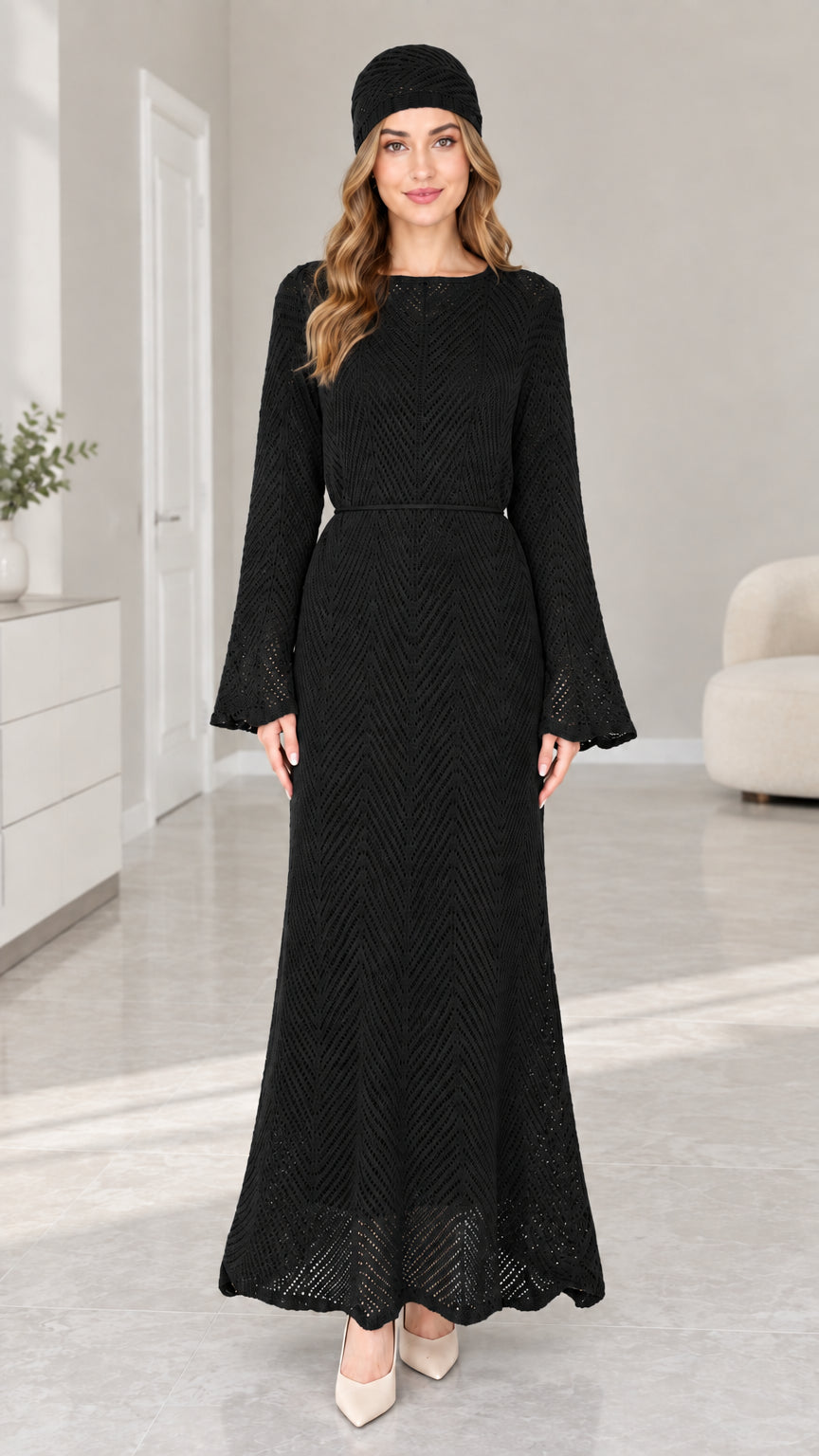 Front view of woman wearing Black pointelle knit long sleeve maxi dress