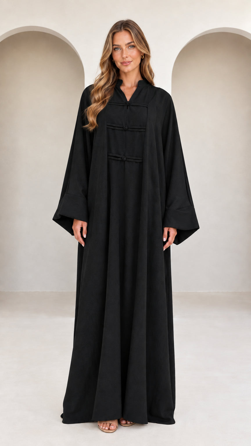 Front view of model wearing black mandarin collar long sleeve abaya maxi dress