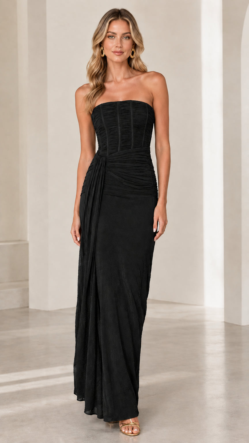 Full front view of classic black strapless corset draped maxi gown