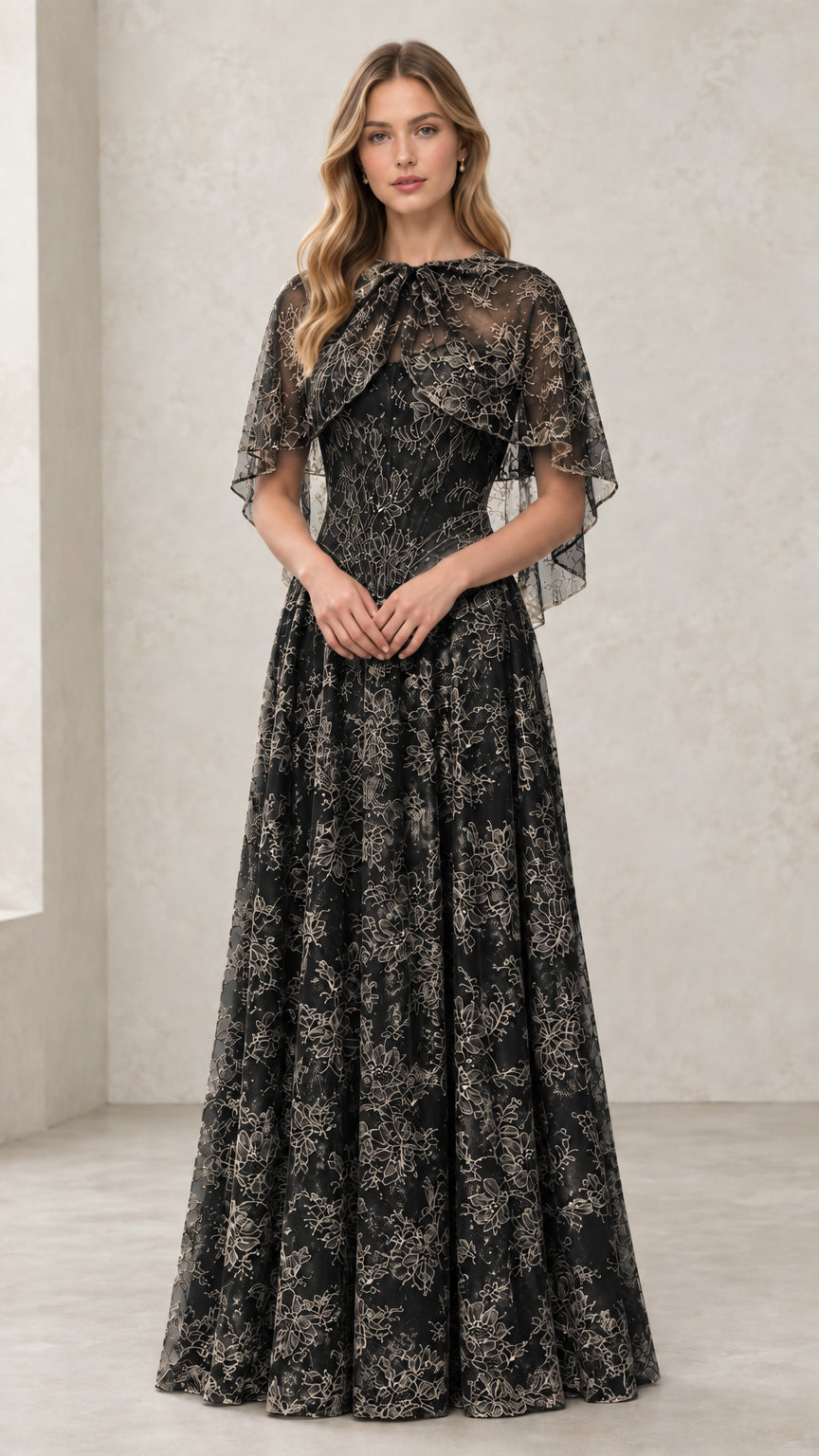 Woman wearing Black embroidered lace capelet evening gown