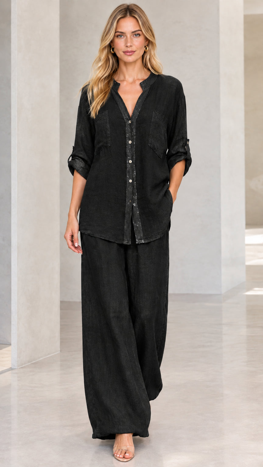 Full-length front view of black button-down shirt and wide-leg pants matching set