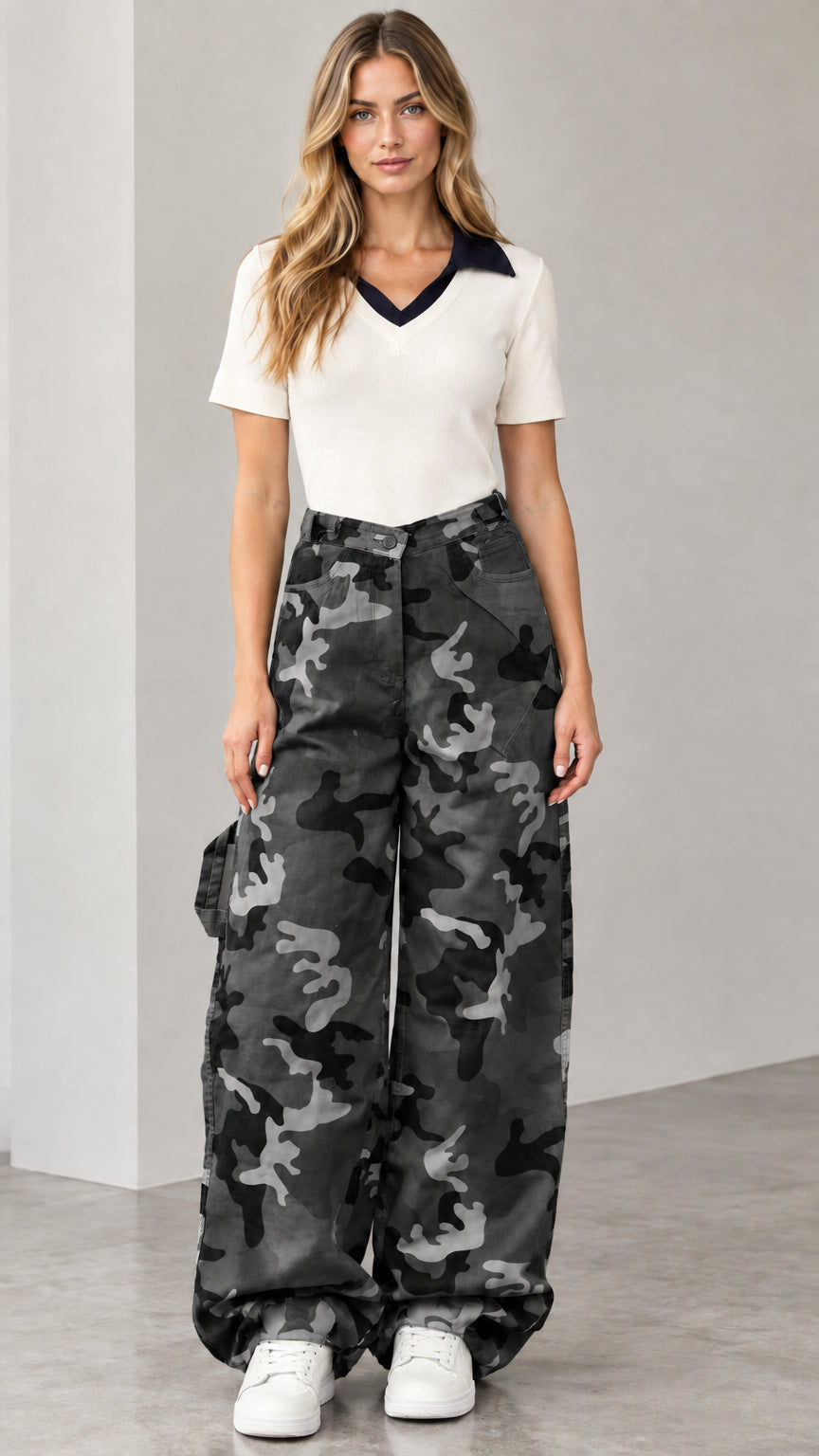Model wearing black and charcoal camo wide-leg cargo pants