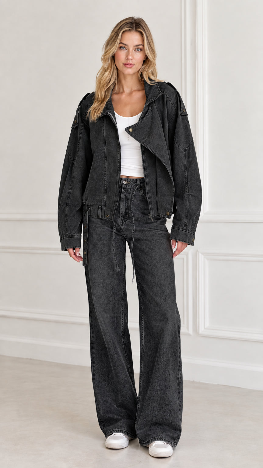 Model wearing Washed Black utility moto jacket with matching dark wash jeans