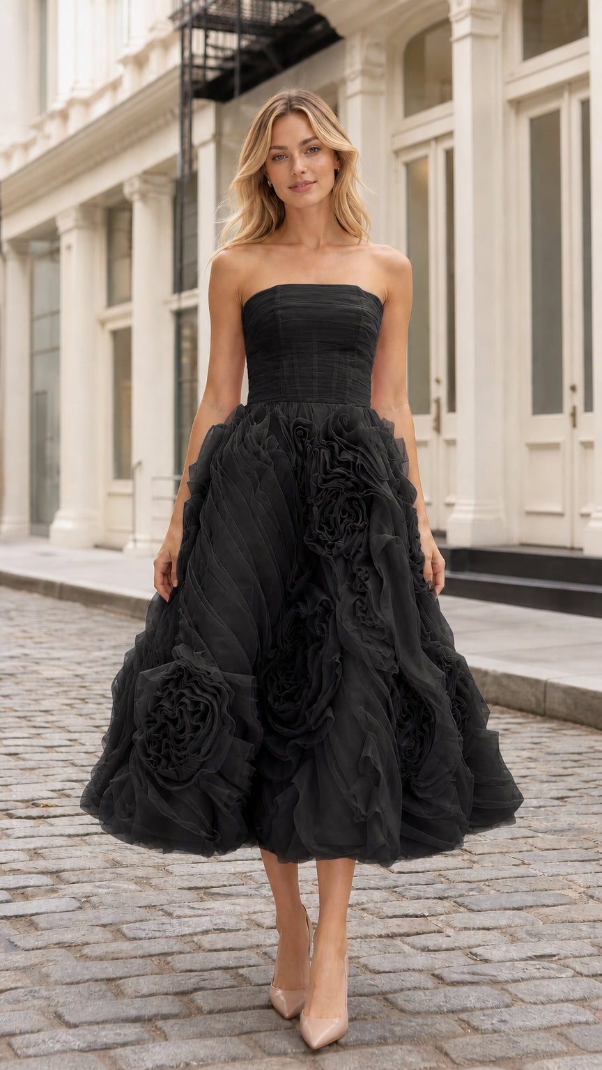 Front view of black strapless tulle midi dress with floral details