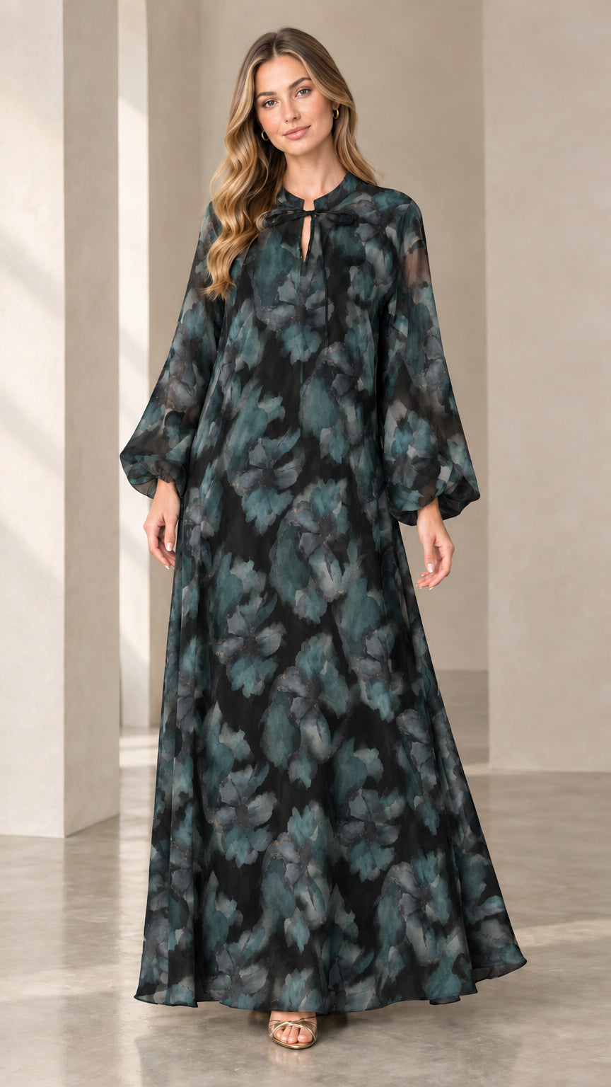 Front view of woman wearing dark teal watercolor floral maxi dress