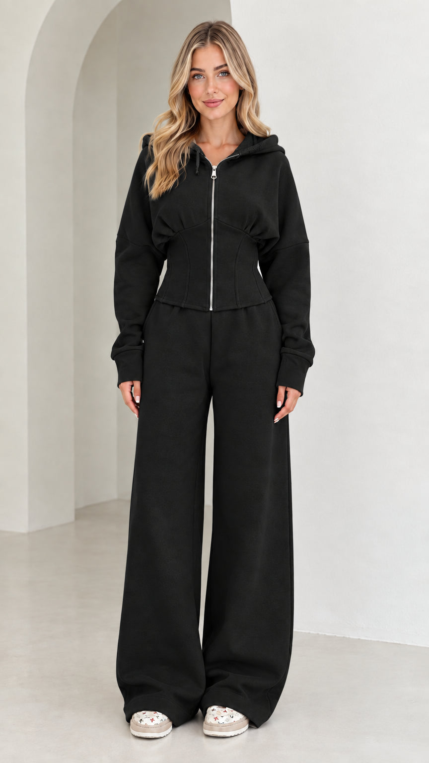 Full-length view of women's corset hoodie and wide-leg sweatpants set in Black