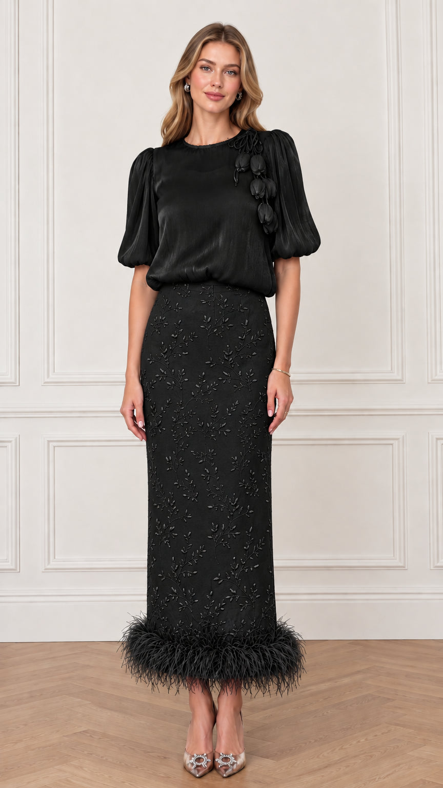 Model wearing Classic Black puff sleeve top and matching embroidered feather trim maxi skirt